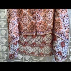 NWT Sleeveless blouse. Lined. Asymmetrical bottom.